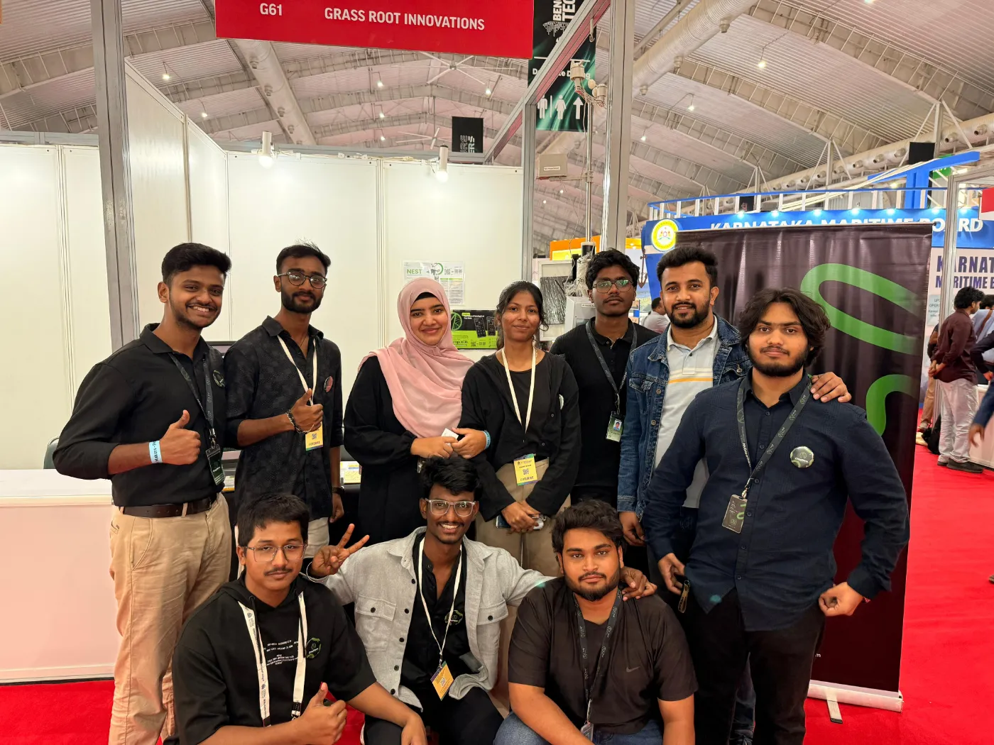 The team posing together at the exhibition
