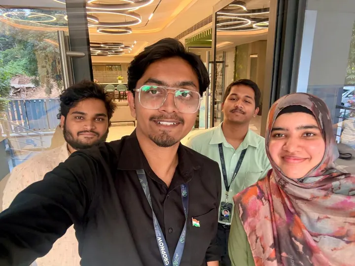 Four team members in a selfie
