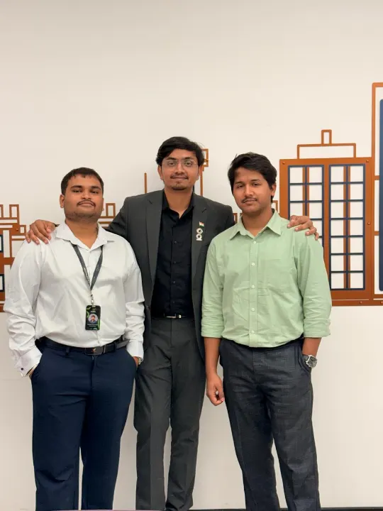 Three team members in formal clothes