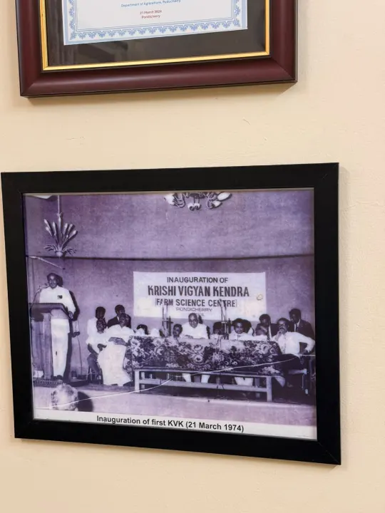 A framed black-and-white photograph of the inauguration of the first Krishi Vigyan Kendra